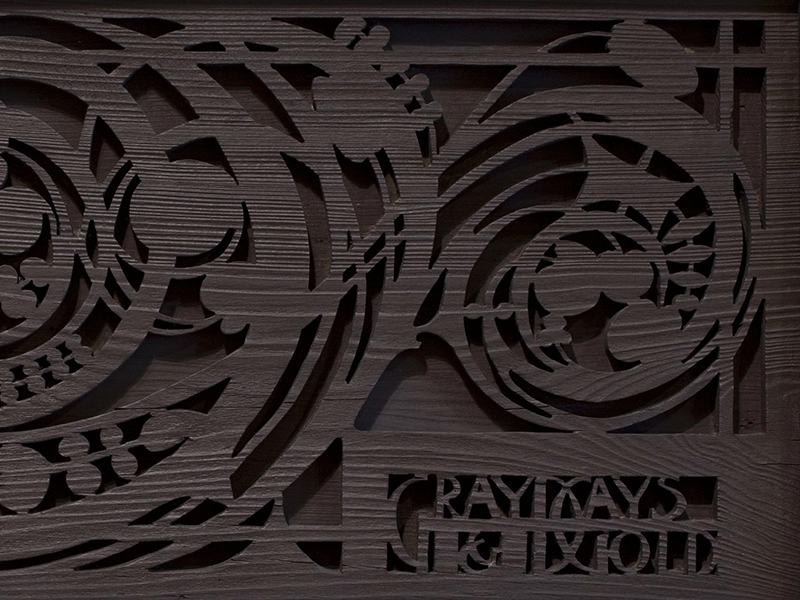 Art nouveau carved wood panel with the words Gray Days and Gold